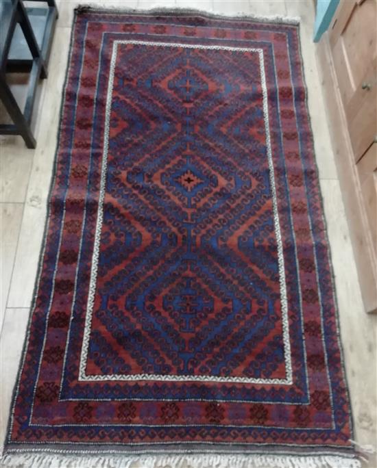 A small Belouch rug, woven with three lozenges Approx. 200 x 110cm